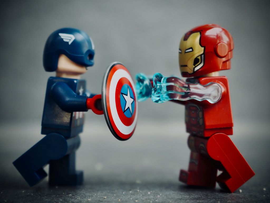 A photo of an Iron Man and Captain America Lego MiniFig fighting.